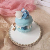 Dekorative Kerze mit Mini-Macarons